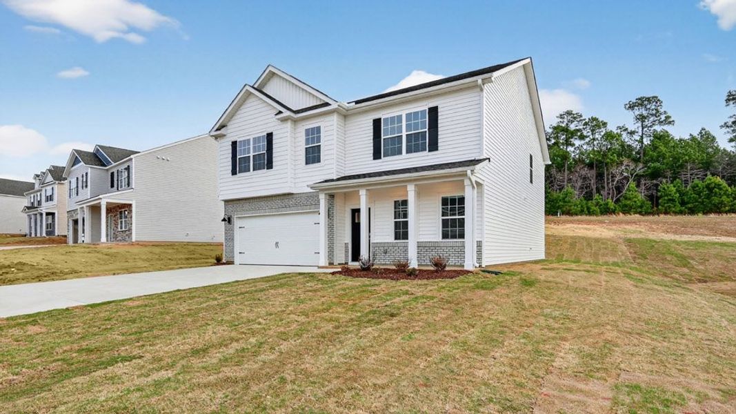 Front exterior of a new home in Olive Branch, Wilson's Mills, NC, highlighting curb appeal (Image 21).