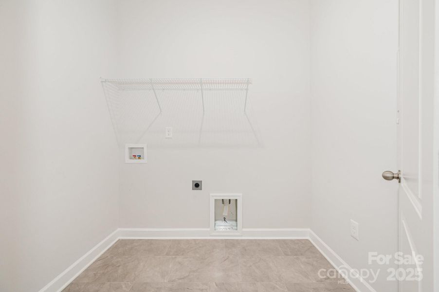 Laundry room right off the 3-car garage entry.