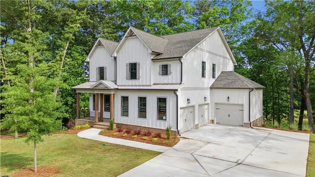 Front exterior of a new home in , Canton, GA, highlighting curb appeal (Image 1). Front exterior of a new home in , Canton, GA, highlighting curb appeal (Image 1).