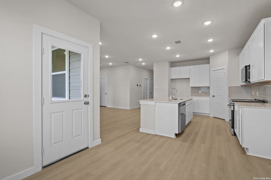 Furnished interior view inside a new home in Cinco Lakes, San Antonio (Image 7).