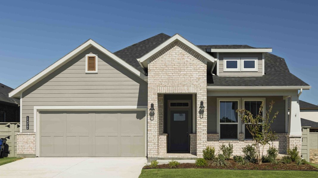 Front exterior of a new home in Treeline, Justin, TX, highlighting curb appeal (Image 1).