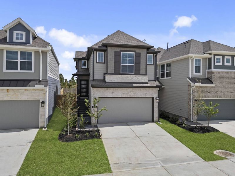 Front exterior of a new home in Bridgeland 45's, Cypress, TX, highlighting curb appeal (Image 23).