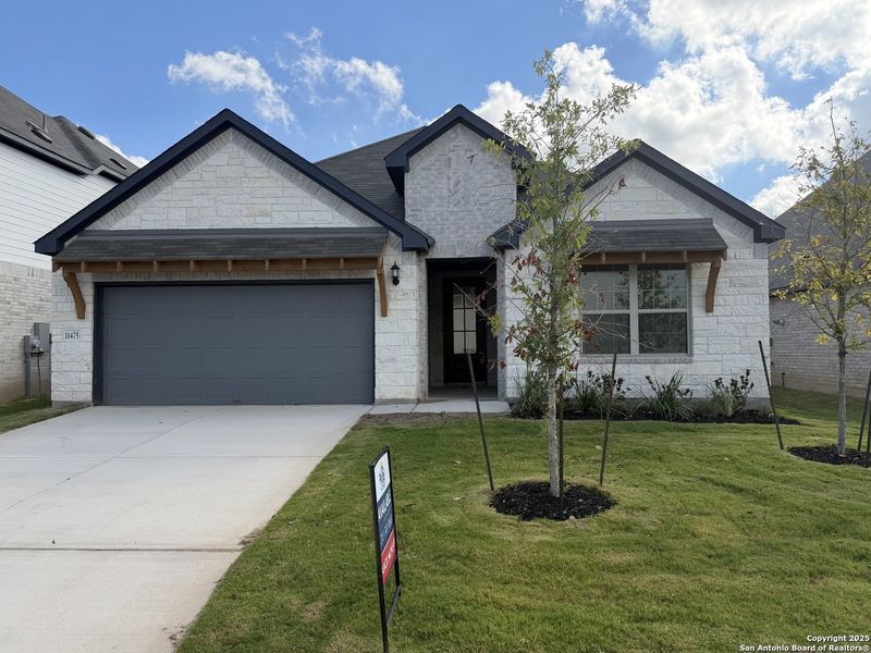 Front exterior of a new home in Davis Ranch, San Antonio, TX, highlighting curb appeal (Image 1). Front exterior of a new home in Davis Ranch, San Antonio, TX, highlighting curb appeal (Image 1).