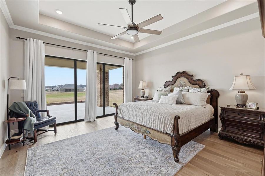 The Primary Suite is a Magnificent Private Sanctuary positioned to Capture Sweeping Fairway Views with a Dramatic Wall of Three-Panel Sliding Glass that opens to the Outdoor Pavilion. Grand in Scale yet Serene in Ambiance, this Luxurious Retreat offers a True Sense of Escape within the Home and Enjoys a Luxurious En-Suite Bath.