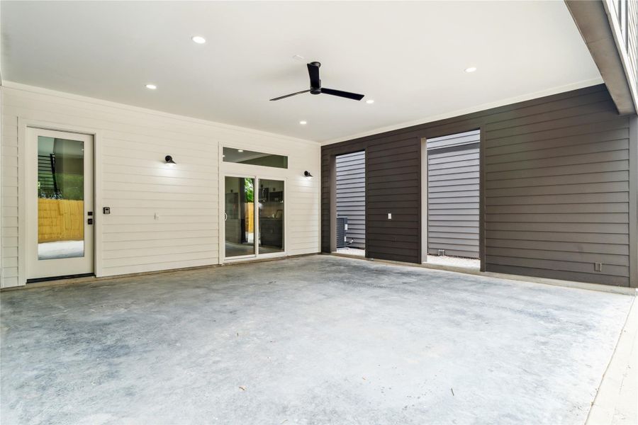 Enjoy the convenience and protection of oversized covered parking, complete with lighting, ceiling fan, and easy access to the interior of your home.