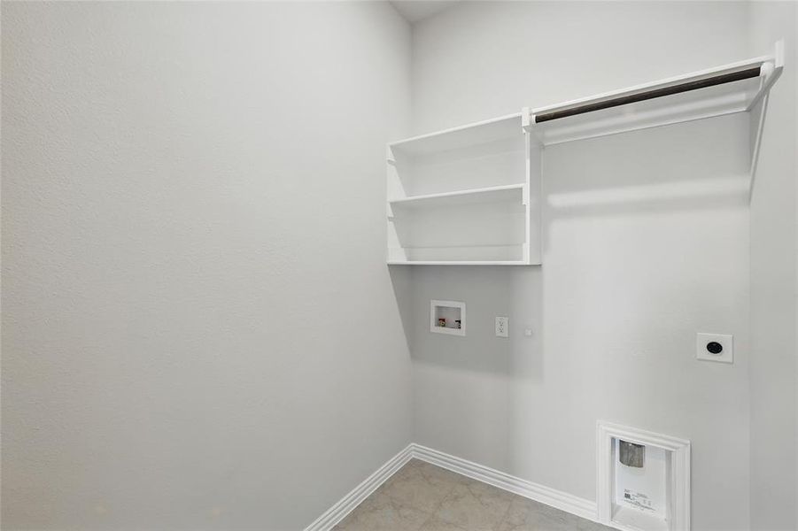 Laundry room featuring electric dryer hookup, hookup for a washing machine, baseboards, and gas dryer hookup Laundry room featuring electric dryer hookup, hookup for a washing machine, baseboards, and gas dryer hookup