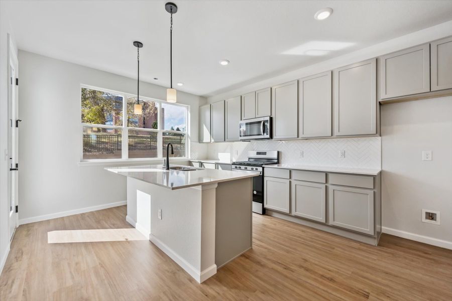 A kitchen with white cabinets. A kitchen with white cabinets.