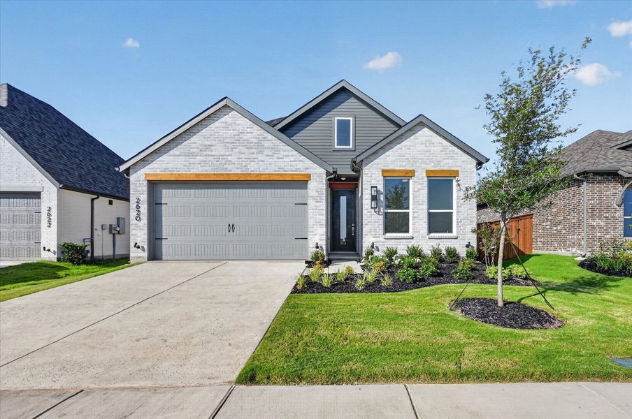Front exterior of a new home in Meraki, McLendon-Chisholm, TX, highlighting curb appeal (Image 1). Front exterior of a new home in Meraki, McLendon-Chisholm, TX, highlighting curb appeal (Image 1).