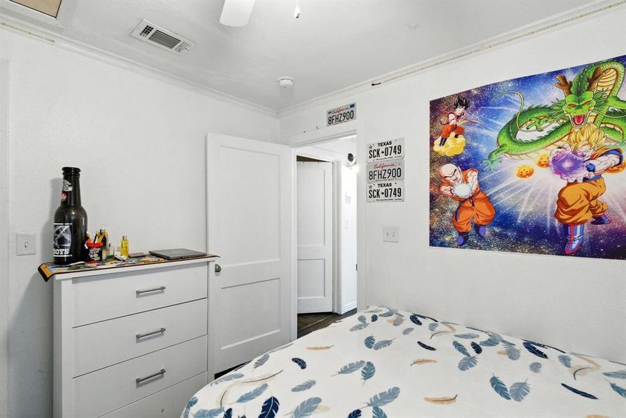 Bedroom with crown molding and ceiling fan
