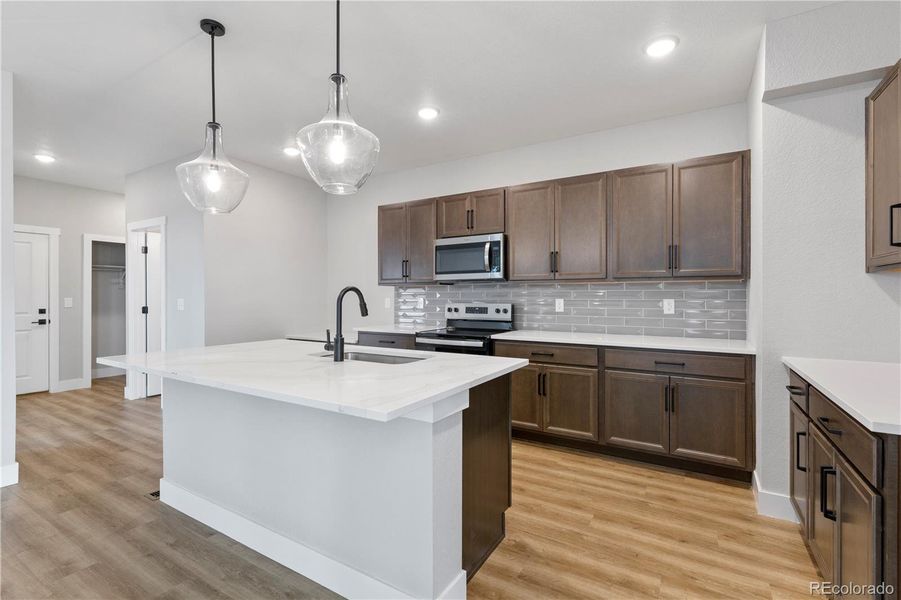 Furnished interior view inside a new home in Windler Single Family Homes, Aurora (Image 6).