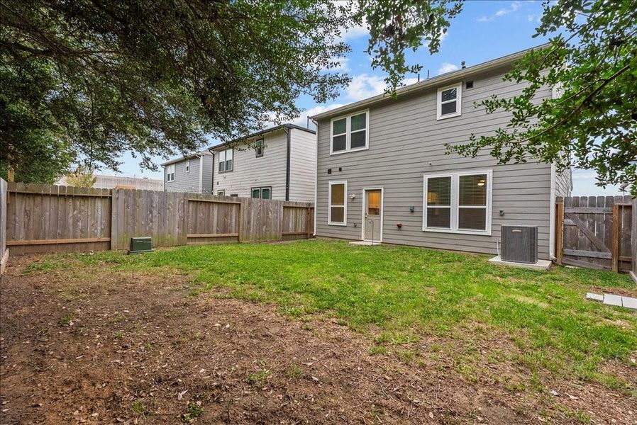 View of the back of the home and yard