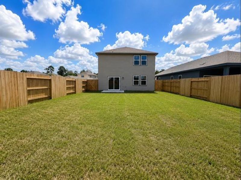 Exterior details and patio area of a home in The Landing, New Caney (Image 2). Exterior details and patio area of a home in The Landing, New Caney (Image 2).