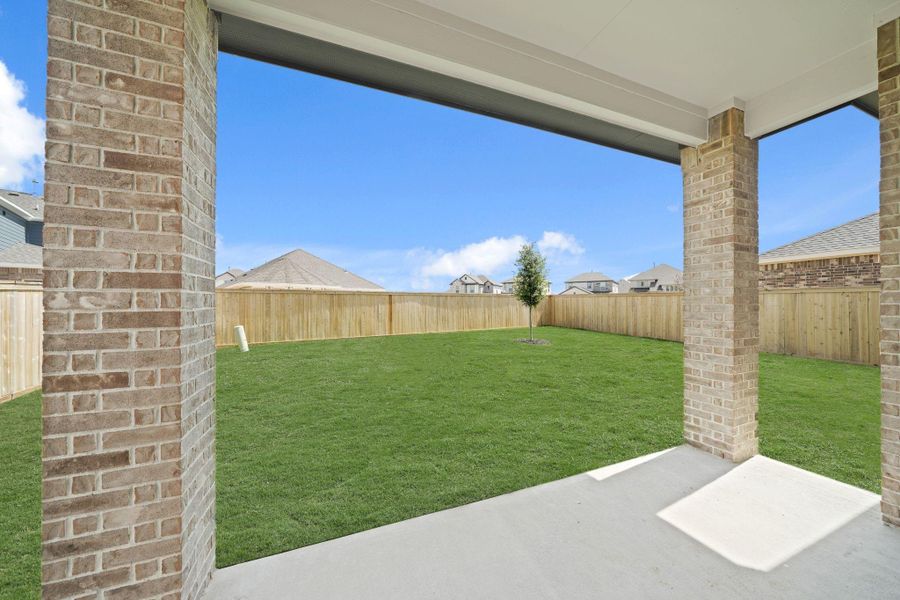 Exterior details and patio area of a home in Creekland Village at Bridgeland, Cypress (Image 3).