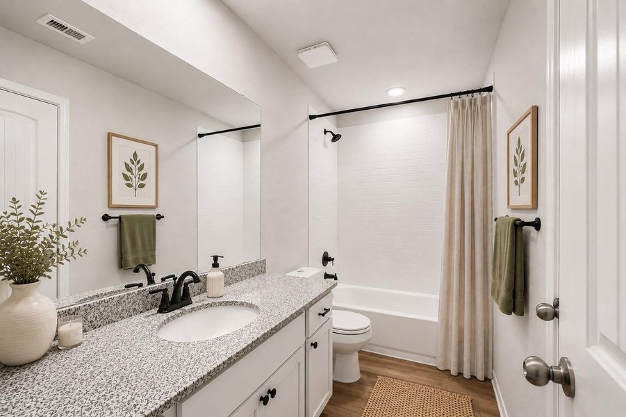 Full bathroom on the 2nd level with a sleek granite countertop, modern fixtures, and a cozy tub-shower combo.