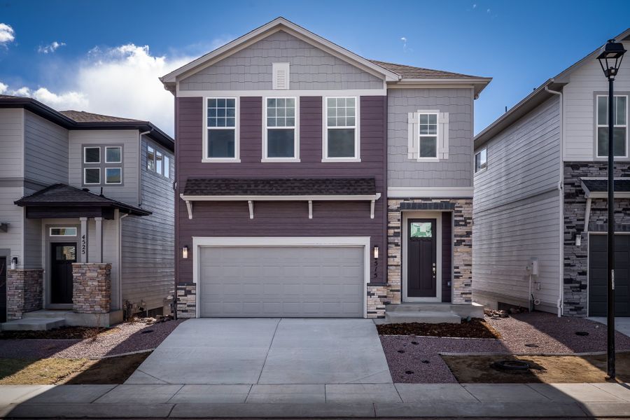 Front exterior of a new home in Trailside at Cottonwood Creek, Colorado Springs, CO, highlighting curb appeal (Image 1). Front exterior of a new home in Trailside at Cottonwood Creek, Colorado Springs, CO, highlighting curb appeal (Image 1).