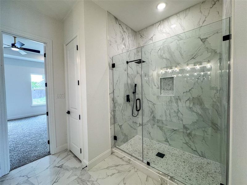 Bathroom featuring a marble finish shower, baseboards, marble finish floors, a ceiling fan, and recessed lighting Bathroom featuring a marble finish shower, baseboards, marble finish floors, a ceiling fan, and recessed lighting