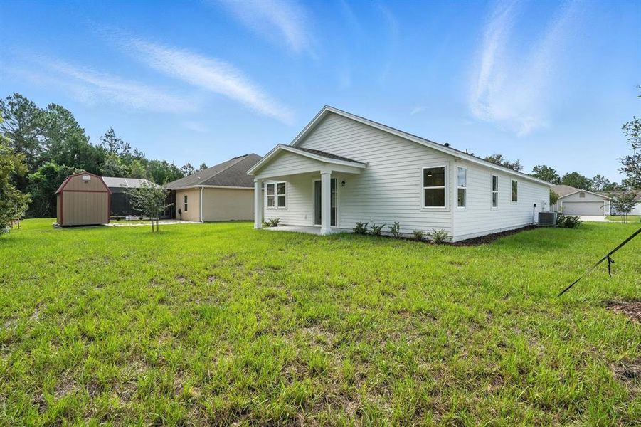 Front exterior of a new home in Palm Coast Homes, Palm Coast, FL, highlighting curb appeal (Image 22).