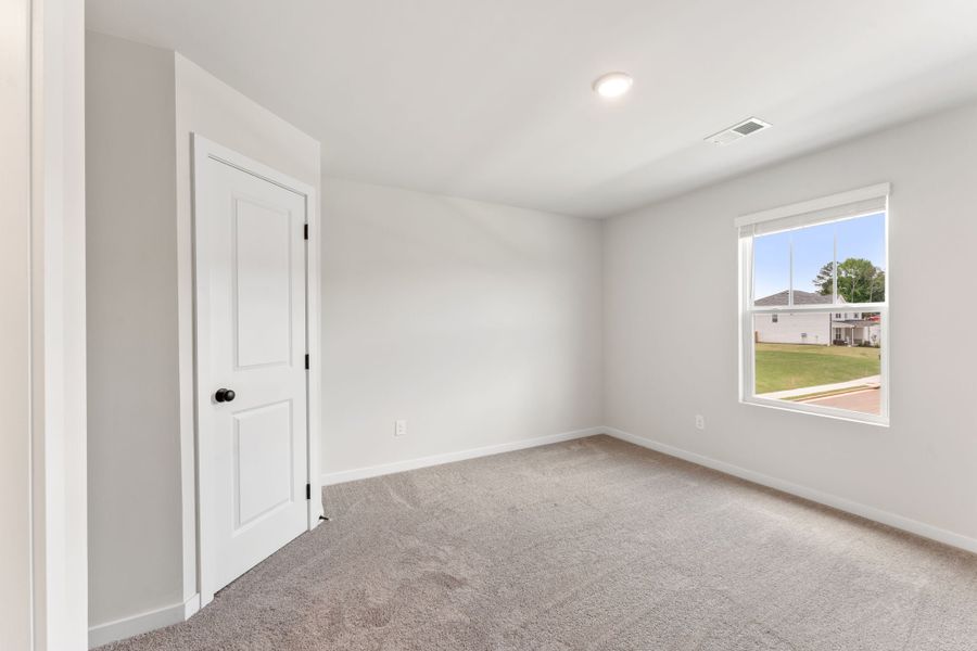 A room with a door and a window.
