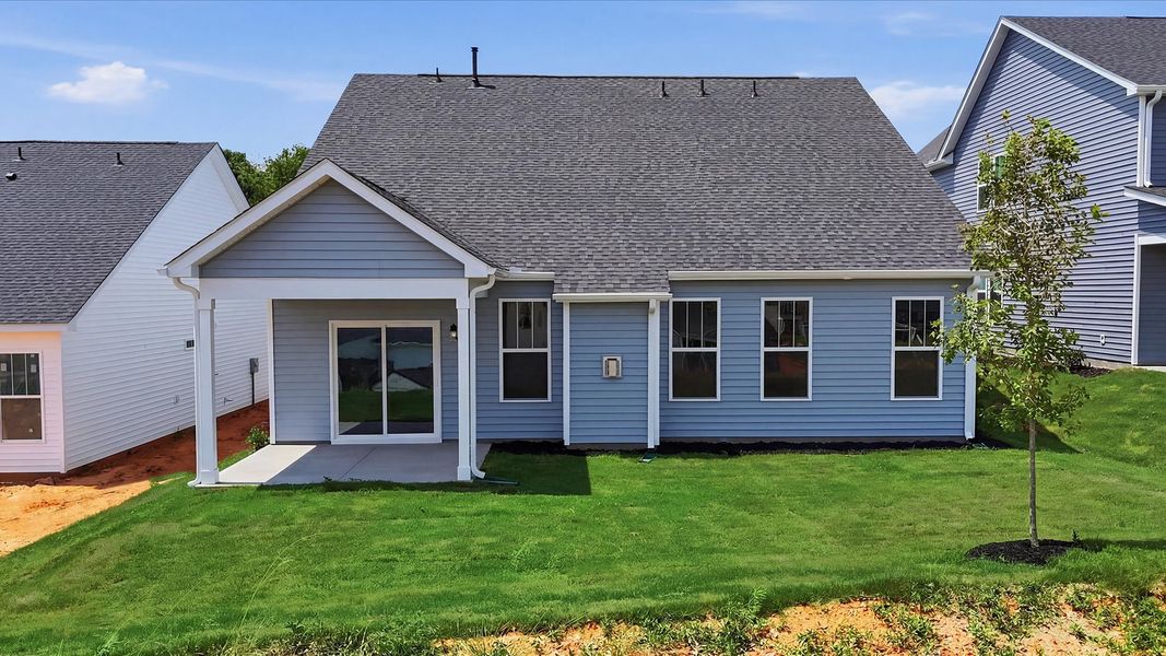 Highly functional rear covered porch adds memorable living space to this elegant home located at Iris Meadows Highly functional rear covered porch adds memorable living space to this elegant home located at Iris Meadows