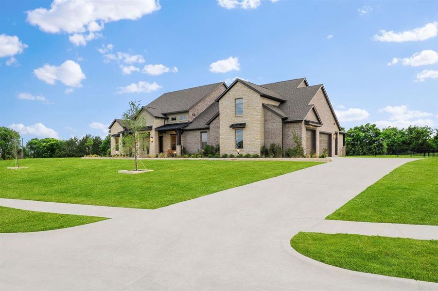 Front exterior of a new home in Chapel View, Heath, TX, highlighting curb appeal (Image 22). Front exterior of a new home in Chapel View, Heath, TX, highlighting curb appeal (Image 22).