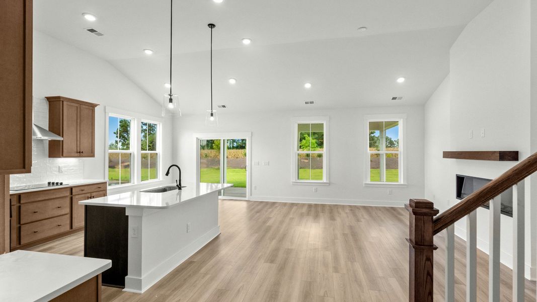 Spacious open-concept kitchen and living area at Chestnut Farms by DRB Homes