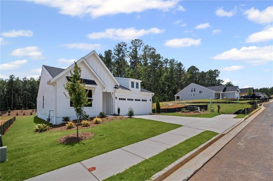 Front exterior of a new home in Easton Park, Dallas, GA, highlighting curb appeal (Image 20).