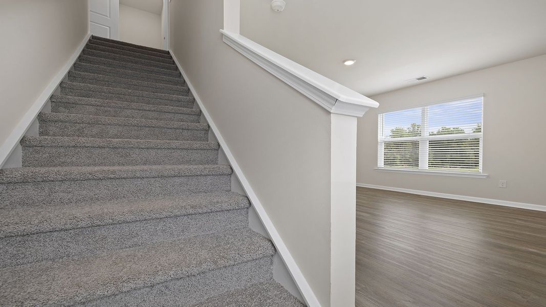 Spacious, unfurnished interior of a new home in Bentley Park, Greenwood (Image 20).