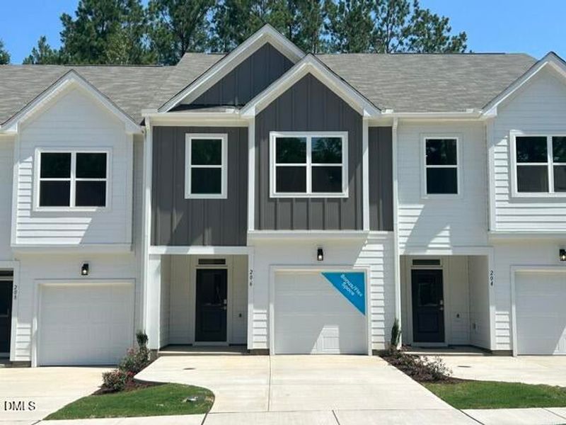 Front exterior of a new home in The Knoll at White Oak, Garner, NC, highlighting curb appeal (Image 2). Front exterior of a new home in The Knoll at White Oak, Garner, NC, highlighting curb appeal (Image 2).
