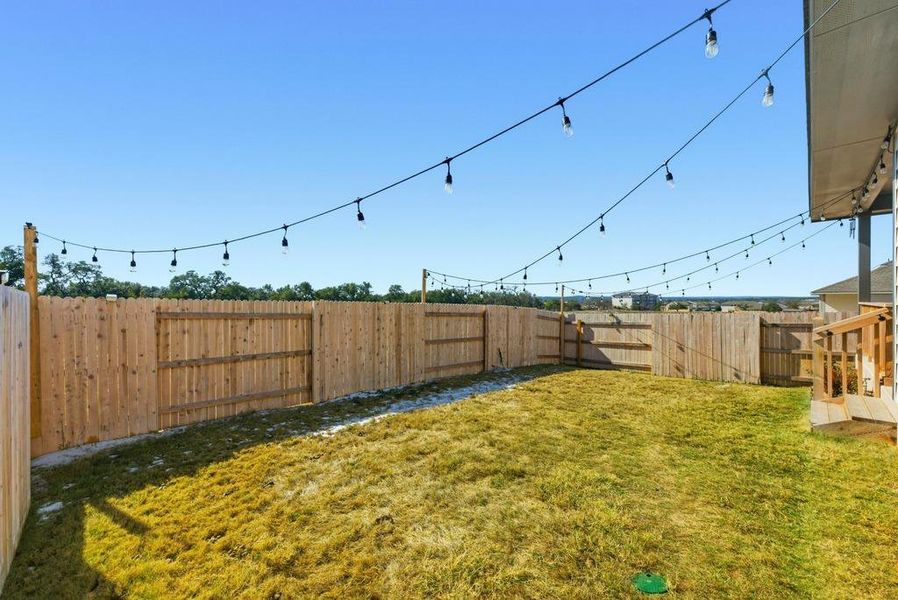 View of fenced backyard