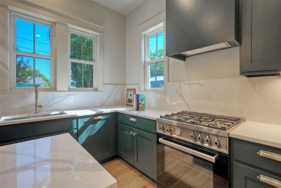 Bertazzoni range, custom cabinets and quartz countertops.