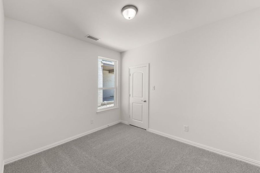 Representative unfurnished interior of a home built from the Cypress by UnionMain Homes in Edgewater, Fate (Image 39).