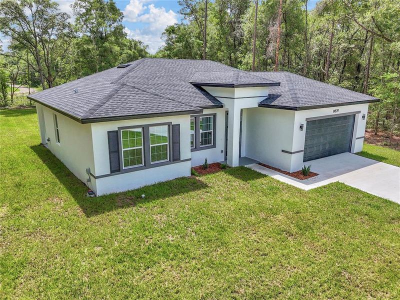 Front exterior of a new home in , Dunnellon, FL, highlighting curb appeal (Image 18).