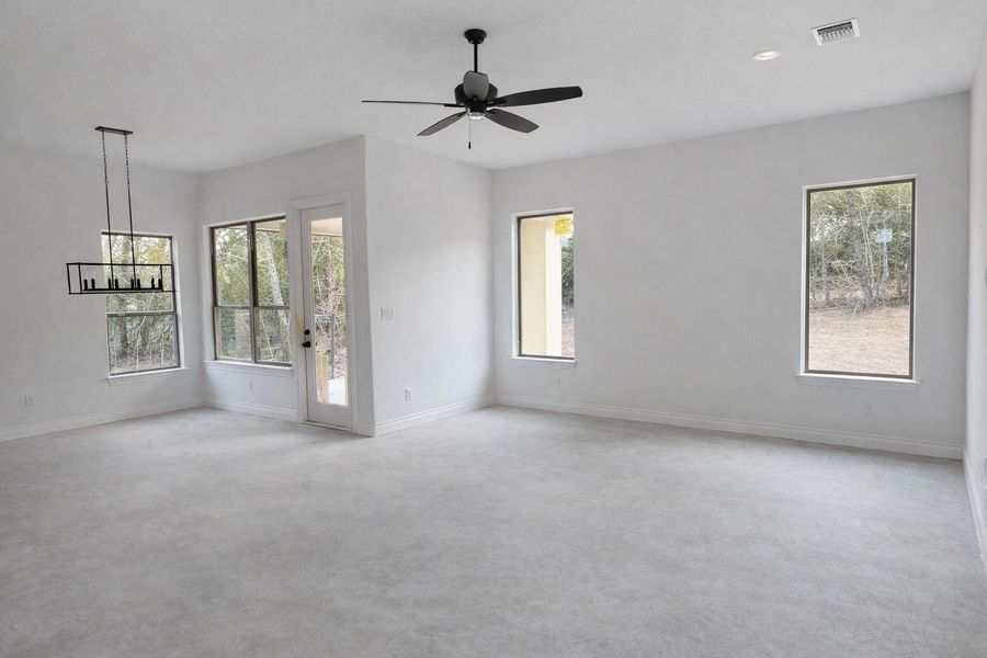Spacious, unfurnished interior of a new home in The Colony- Pine Cove, Bastrop (Image 3).