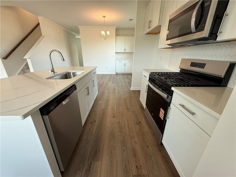 Streamlined kitchen boasts durable quartz countert Streamlined kitchen boasts durable quartz countert