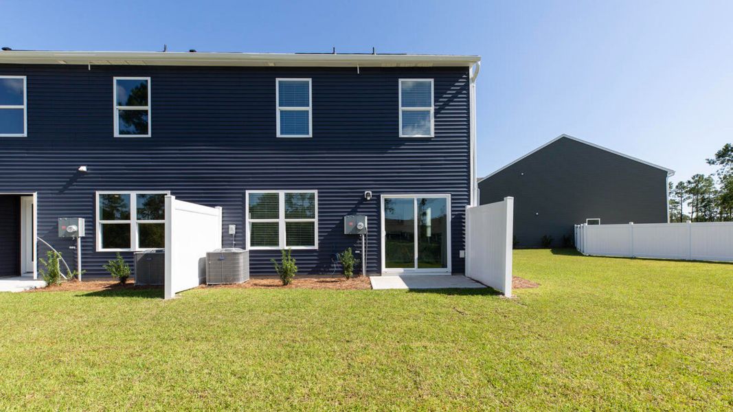 Front exterior of a new home in Grayson Park Townhomes, Leland, NC, highlighting curb appeal (Image 14).