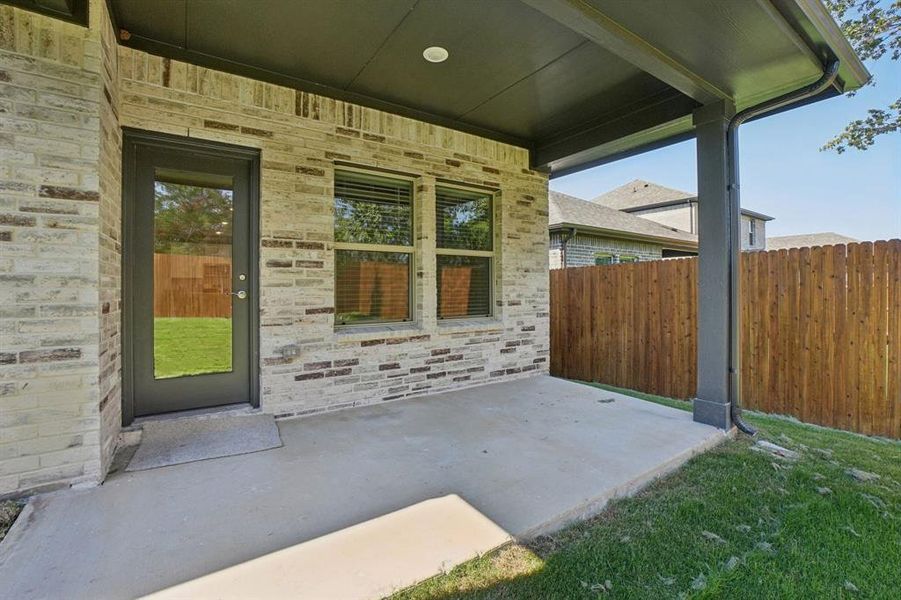 Exterior details and patio area of a home in Eastridge - Spring Series, McKinney (Image 20). Exterior details and patio area of a home in Eastridge - Spring Series, McKinney (Image 20).
