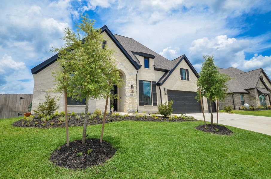 Front exterior of a new home in Escondido, Magnolia, TX, highlighting curb appeal (Image 2).