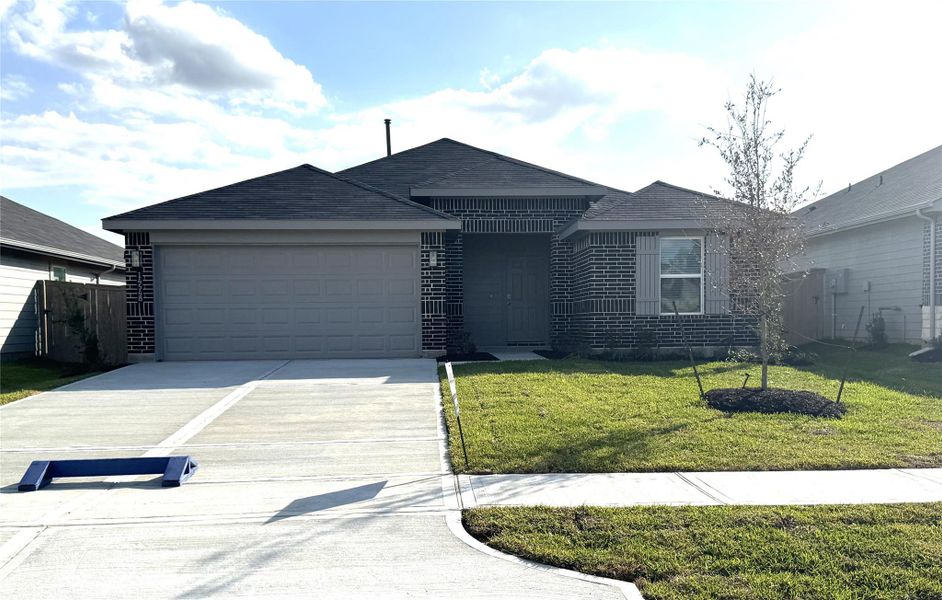 Front exterior of a new home in The Canopies, Splendora, TX, highlighting curb appeal (Image 1). Front exterior of a new home in The Canopies, Splendora, TX, highlighting curb appeal (Image 1).