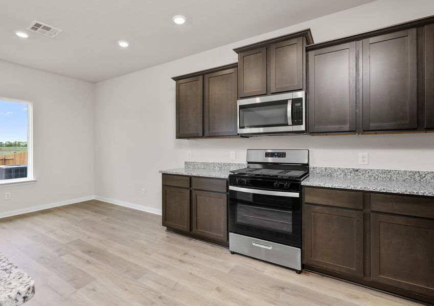 The kitchen has sprawling granite countertops. The kitchen has sprawling granite countertops.