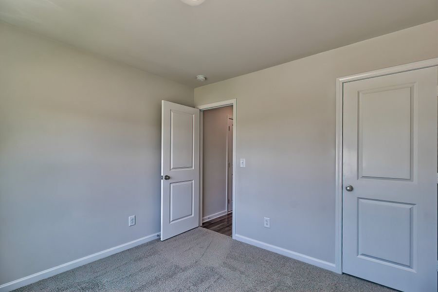 Representative unfurnished interior of a home built from the Juniper by McGuinn Homes in Hunters Branch, Hopkins (Image 18).