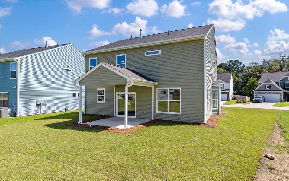 Front exterior of a new home in Oakley Pointe, Moncks Corner, SC, highlighting curb appeal (Image 2).