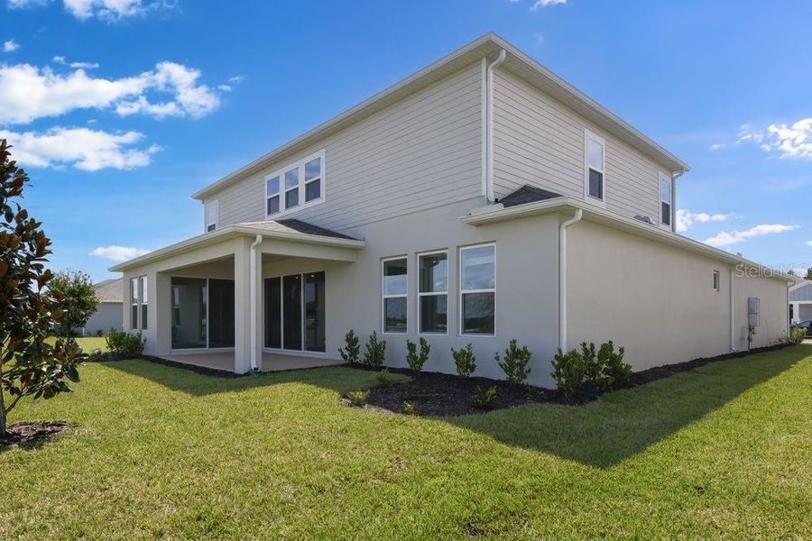 Front exterior of a new home in Ardisia Park, New Smyrna Beach, FL, highlighting curb appeal (Image 24).