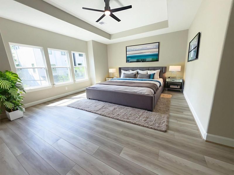 The ROCburne’s primary suite offers everyday convenience with generous closet space and direct access to a spa-inspired ensuite bath. Image depicts home as-is virtually staged.