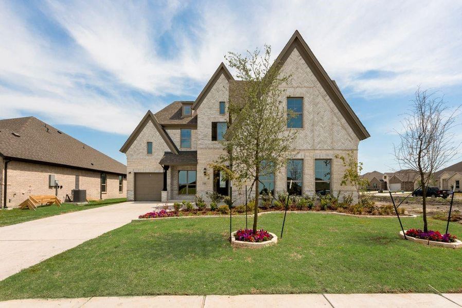 Front exterior of a new home in Park Trails, Forney, TX, highlighting curb appeal (Image 1). Front exterior of a new home in Park Trails, Forney, TX, highlighting curb appeal (Image 1).