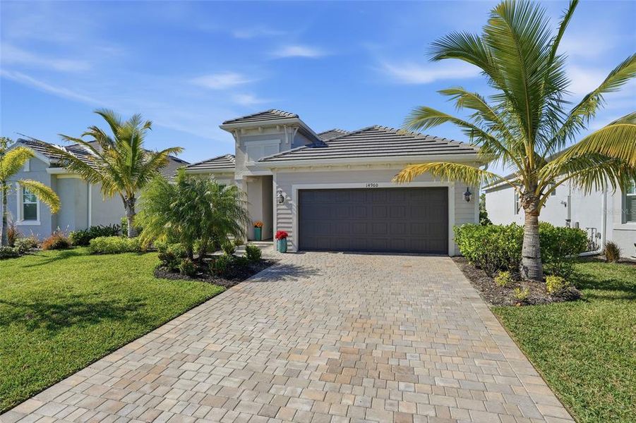 Front exterior of a new home in , Punta Gorda, FL, highlighting curb appeal (Image 1).