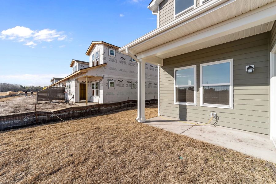 Exterior details and patio area of a home in Blue Heron Retreat, Little River (Image 4).
