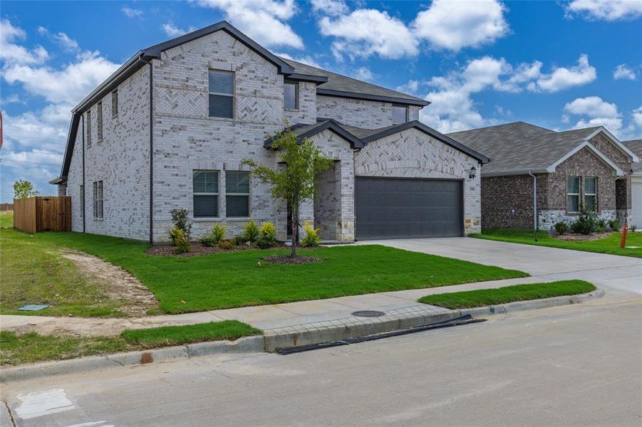 Front exterior of a new home in Stratton Place, Greenville, TX, highlighting curb appeal (Image 17).