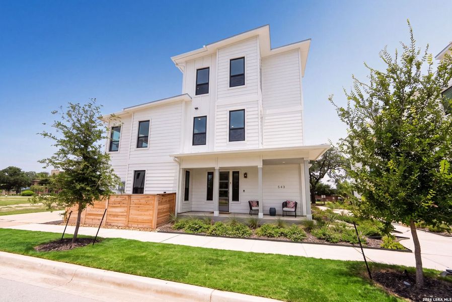 Front exterior of a new home in Victoria Commons, San Antonio, TX, highlighting curb appeal (Image 27).