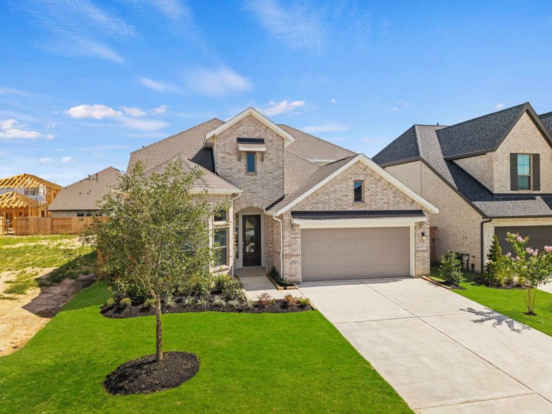 Front exterior of a new home in Candela, Richmond, TX, highlighting curb appeal (Image 21).