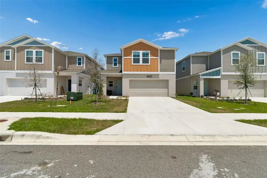 Front exterior of a new home in , Haines City, FL, highlighting curb appeal (Image 26).